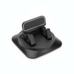 XO Universal 360° Rotating Car Dashboard Phone Holder in matte black clipped to car central console, holding smartphone securely